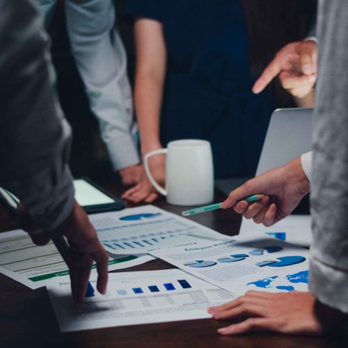 millennial-asia-businessmen-businesswomen-meeting-brainstorming-ideas-about-new-paperwork-project-colleagues-working-together-planning-success-strategy-enjoy-teamwork-small-modern-night-office (1)